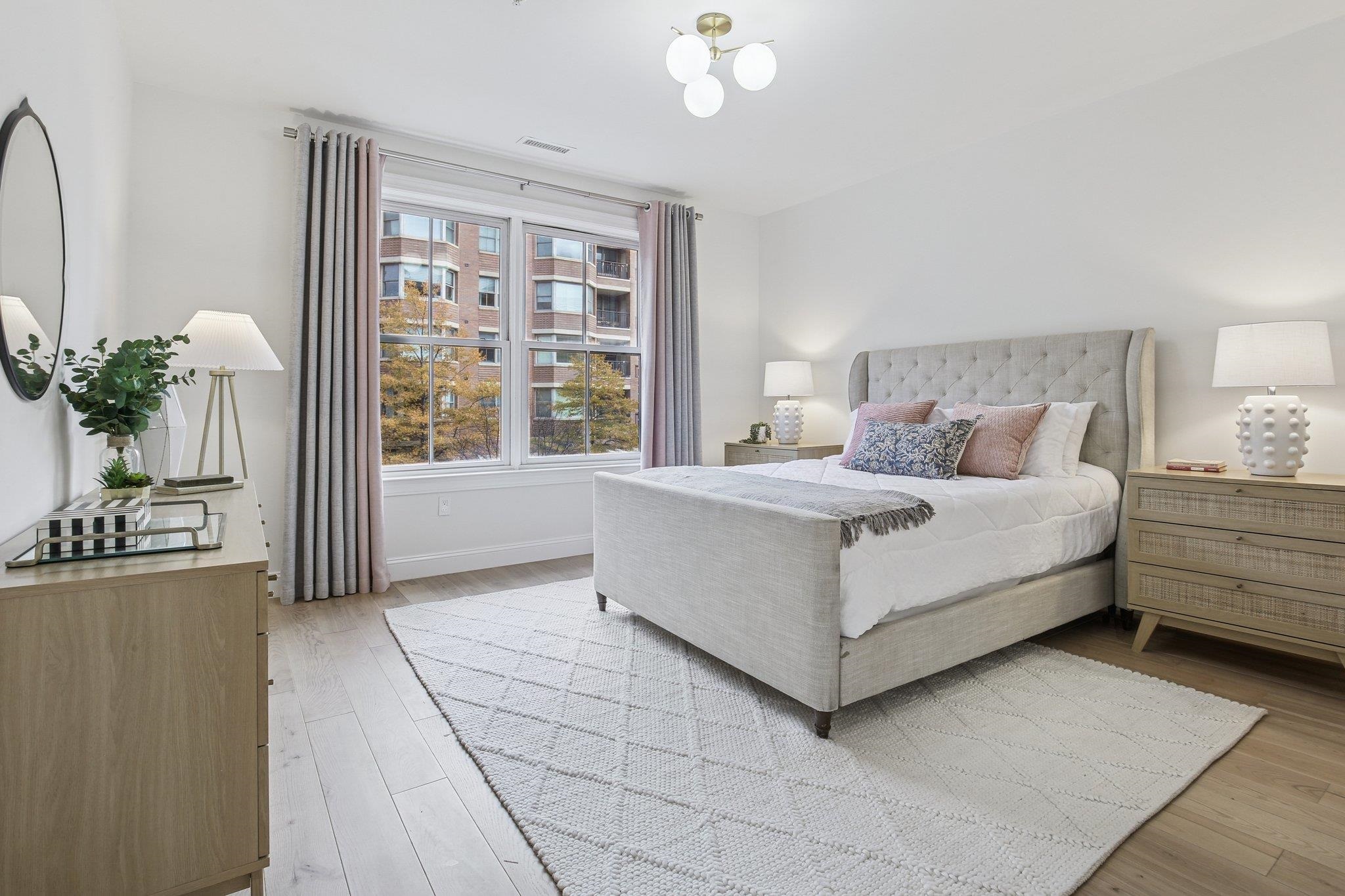 22 Ave At Port Imperial, Unit 208 West New York, NJ 07093 - Photo 11 of 34 a living room with furniture and a large window