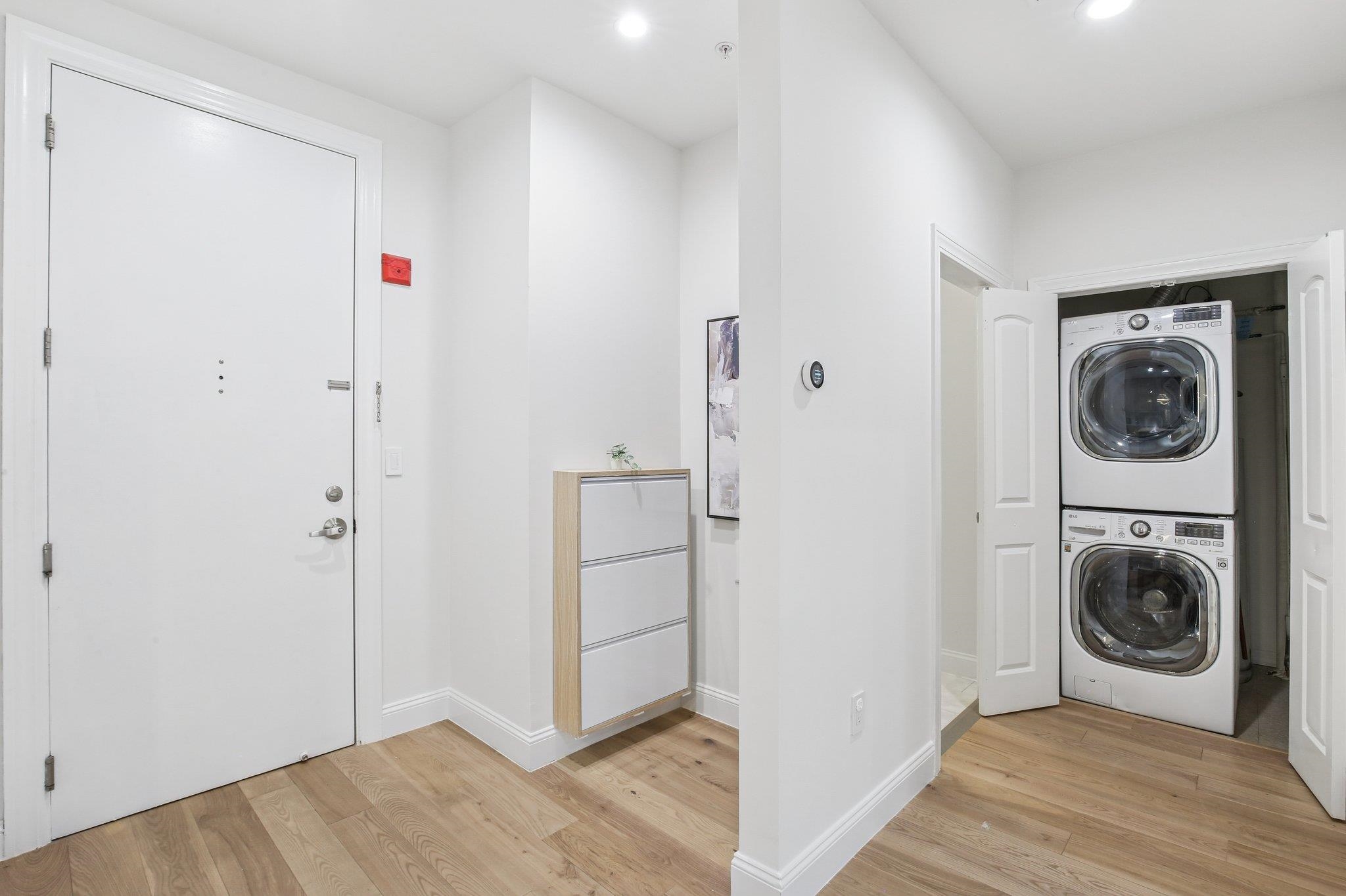 22 Ave At Port Imperial, Unit 208 West New York, NJ 07093 - Photo 13 of 34 a view of a hallway with washer and dryer