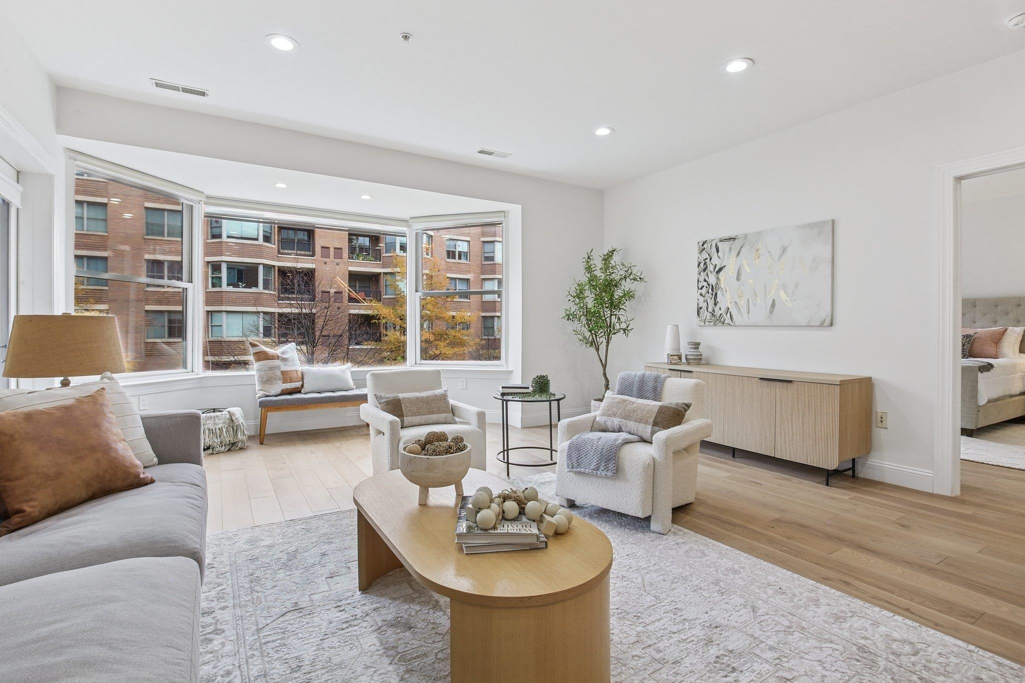 22 Ave At Port Imperial, Unit 208 West New York, NJ 07093 - Photo 16 of 34 a living room with furniture and a large window