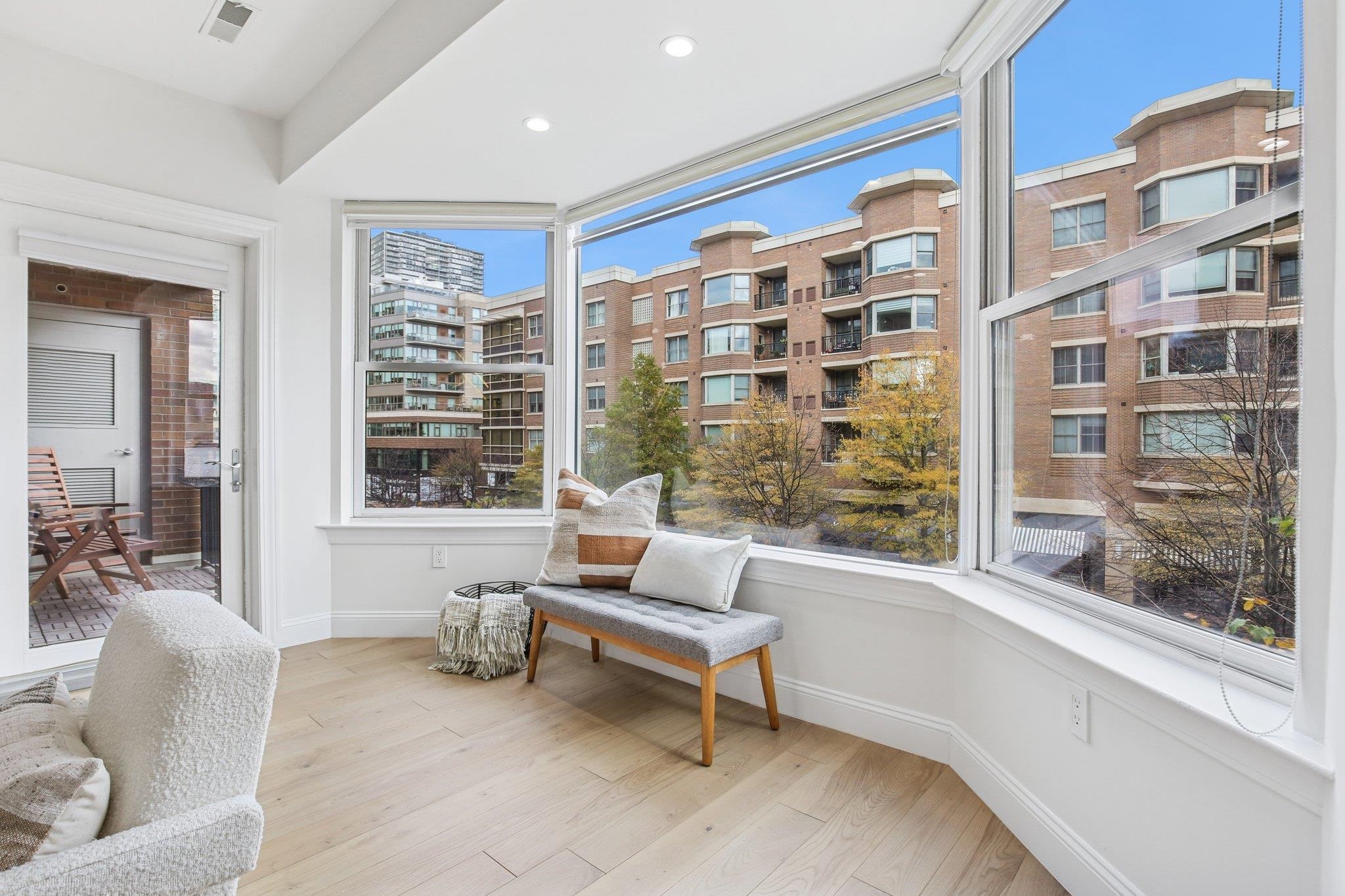 22 Ave At Port Imperial, Unit 208 West New York, NJ 07093 - Photo 21 of 34 a living room with furniture and a large window