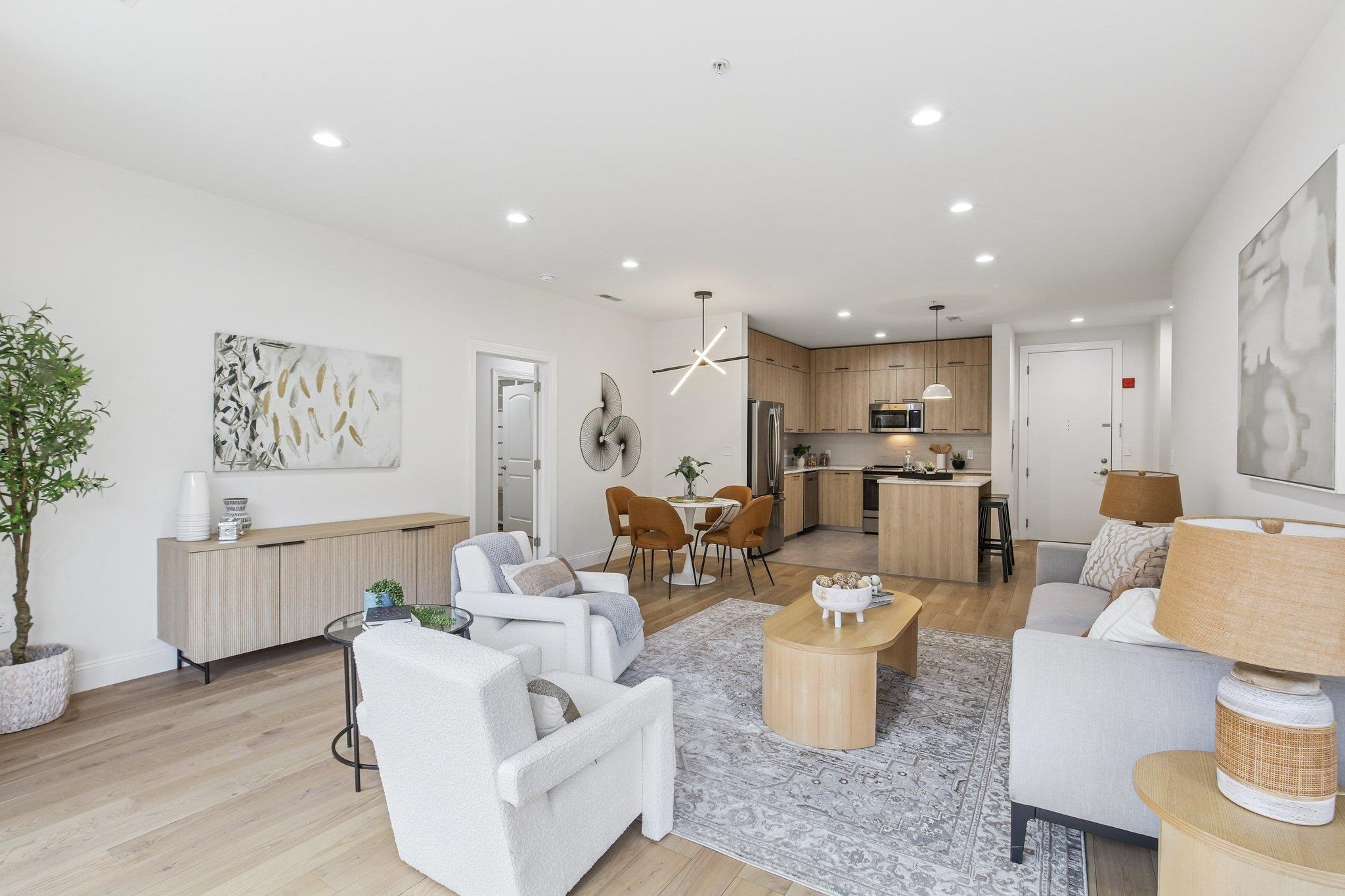 22 Ave At Port Imperial, Unit 208 West New York, NJ 07093 - Photo 22 of 34 a living room with furniture and a kitchen view