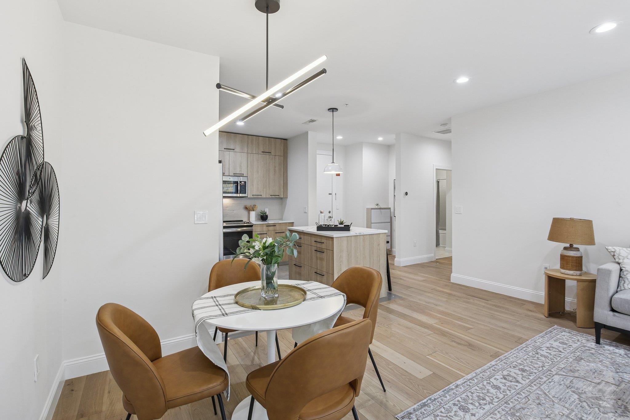 22 Ave At Port Imperial, Unit 208 West New York, NJ 07093 - Photo 23 of 34 a view of a dining room with furniture and wooden floor