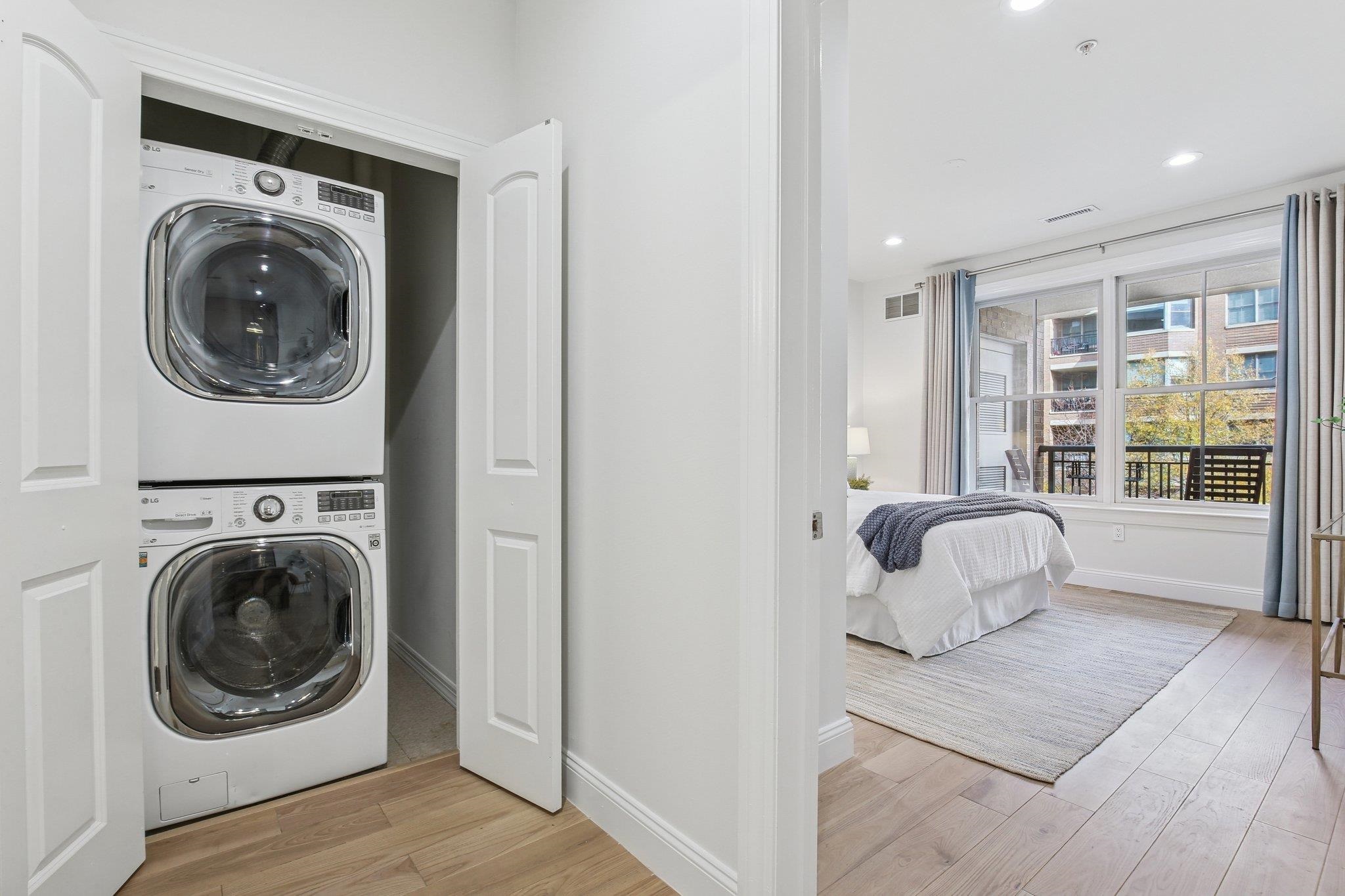 22 Ave At Port Imperial, Unit 208 West New York, NJ 07093 - Photo 25 of 34 a room with furniture and a large window