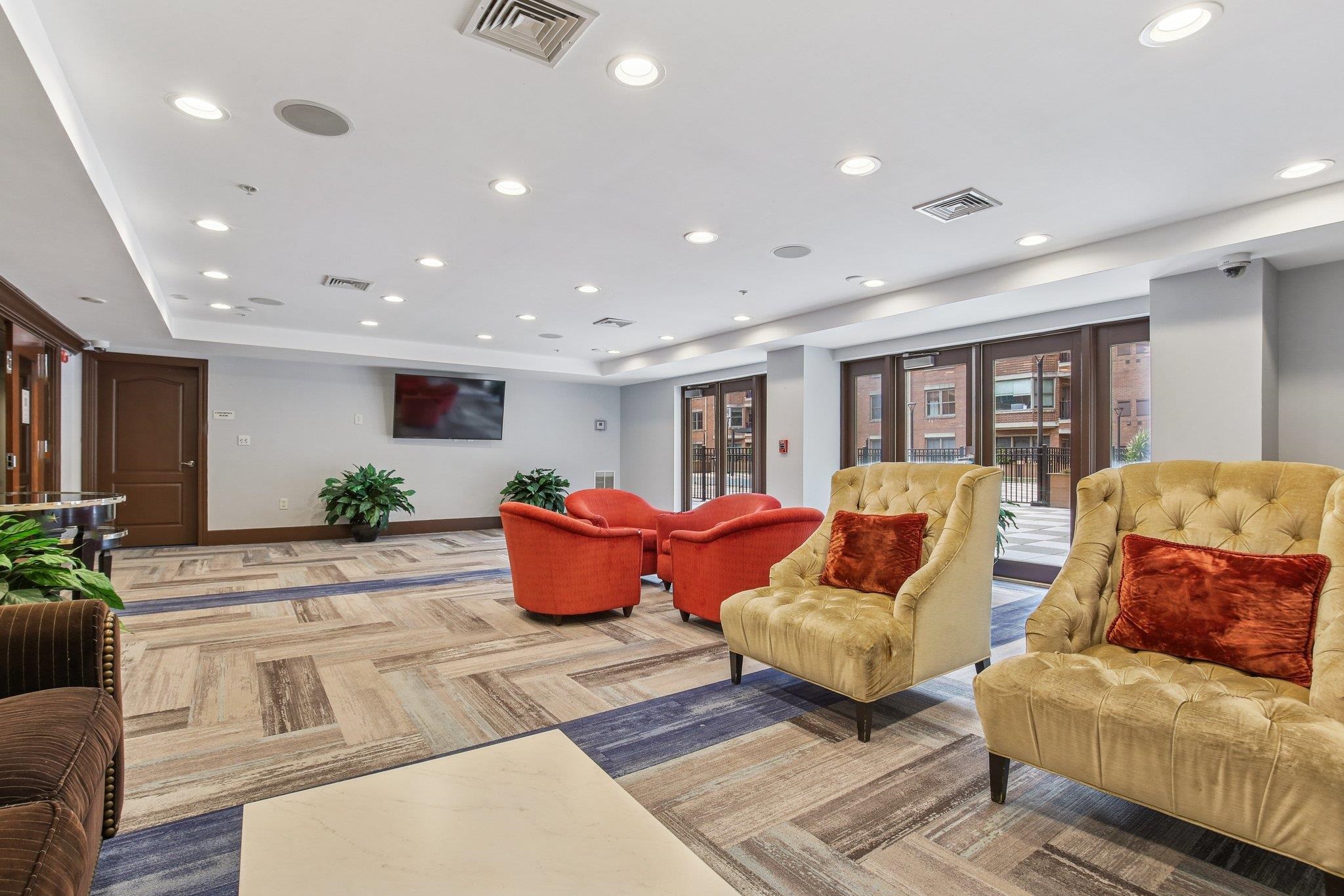 22 Ave At Port Imperial, Unit 208 West New York, NJ 07093 - Photo 30 of 34 a living room with furniture and wooden floor