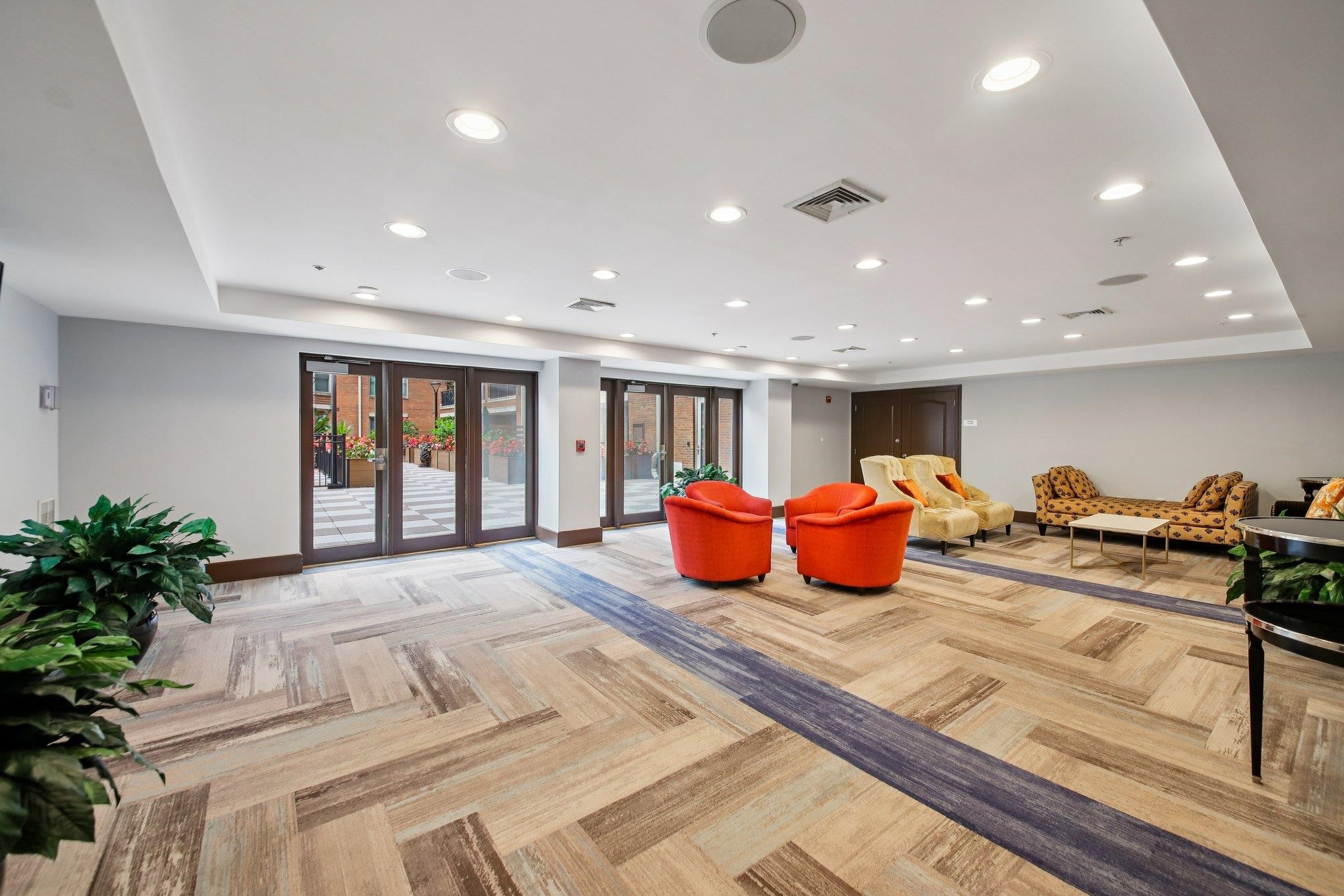 22 Ave At Port Imperial, Unit 208 West New York, NJ 07093 - Photo 31 of 34 a large bedroom with bed and a large window