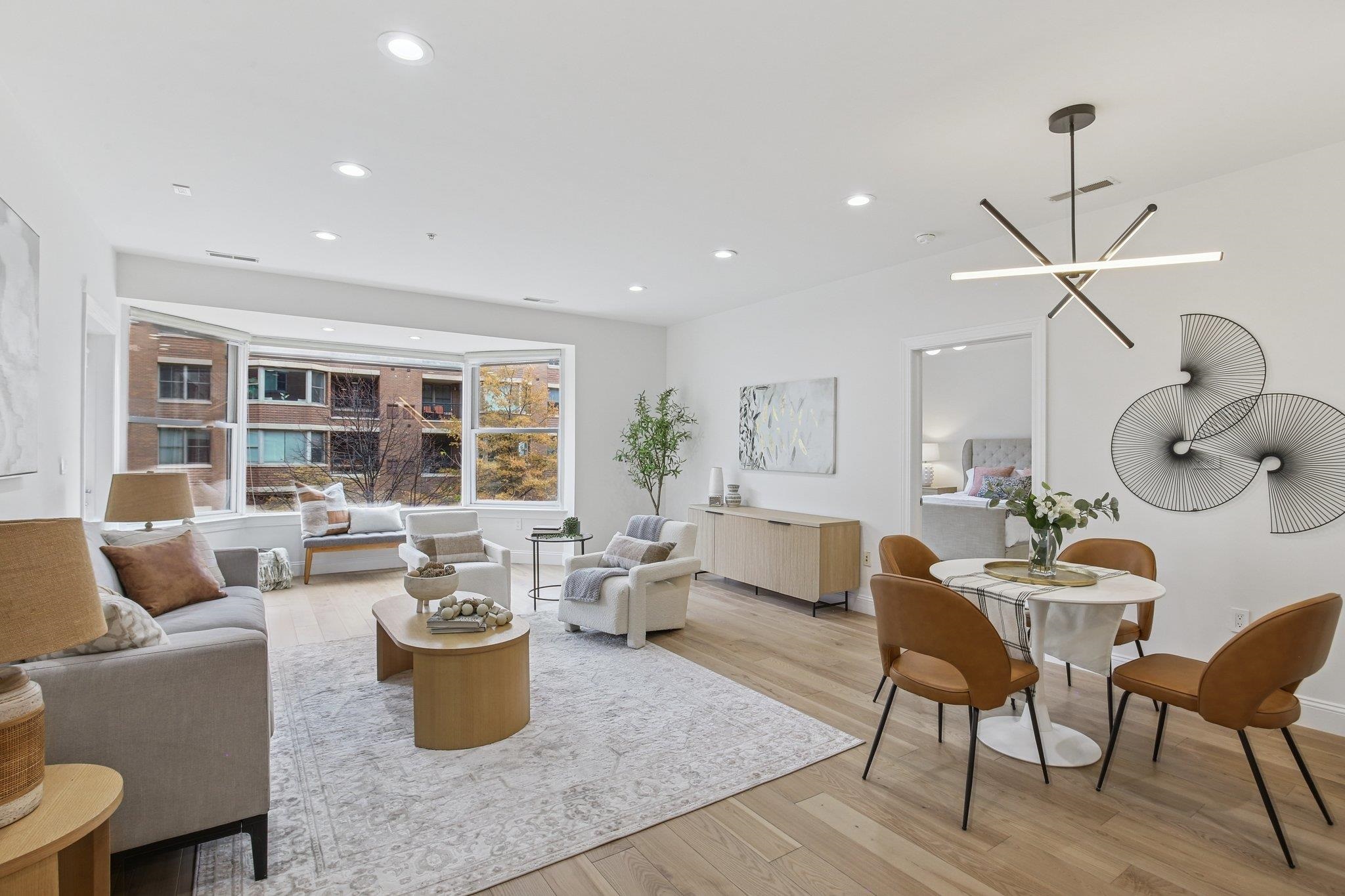 22 Ave At Port Imperial, Unit 208 West New York, NJ 07093 - Photo 7 of 34 a living room with furniture and a wooden floor