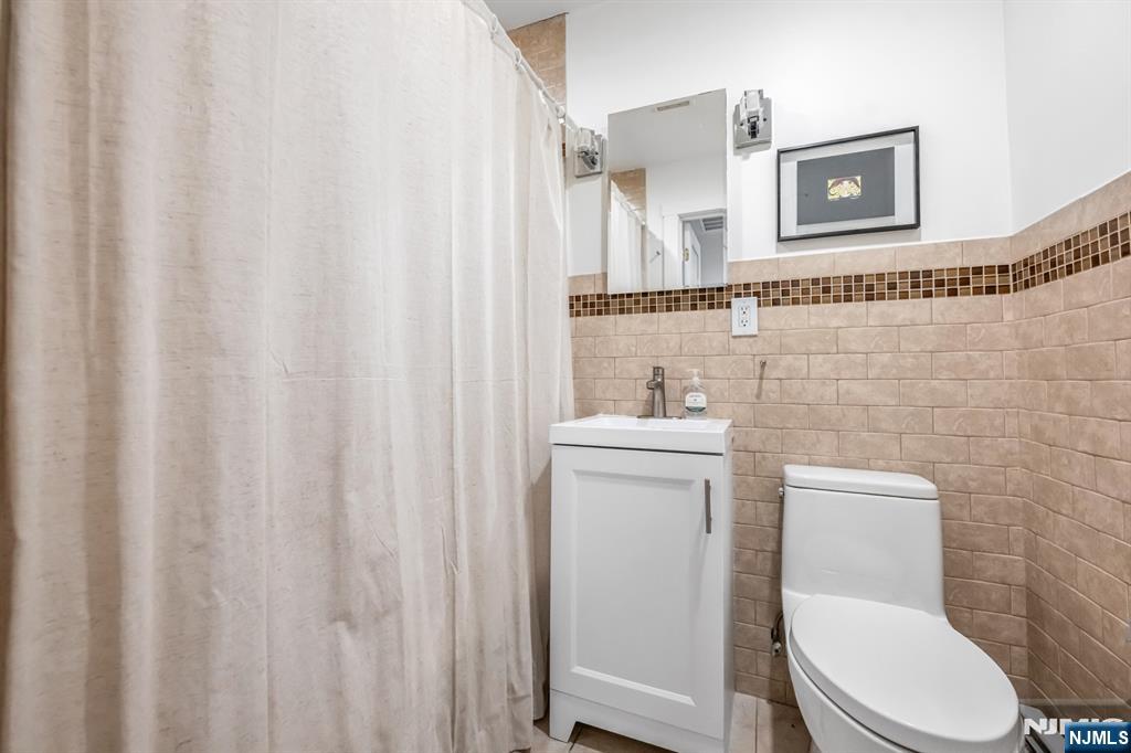 408 Chelsea Street Paramus, NJ 07652 - Photo 25 of 49 a bathroom with a toilet and a sink