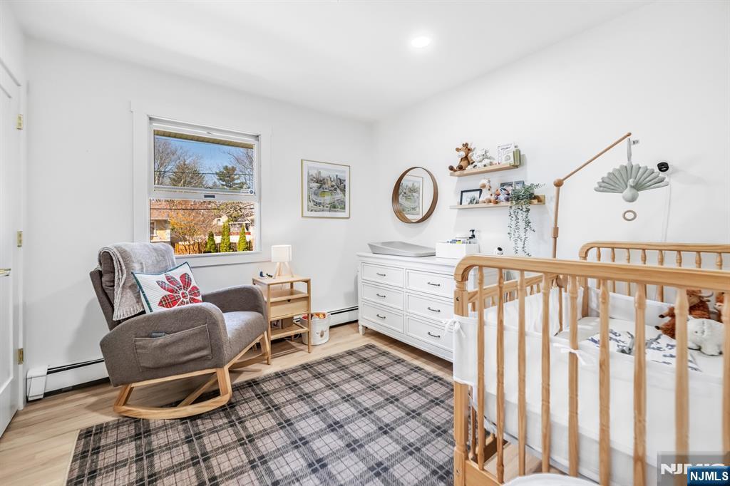 408 Chelsea Street Paramus, NJ 07652 - Photo 28 of 49 a bedroom with furniture and a window