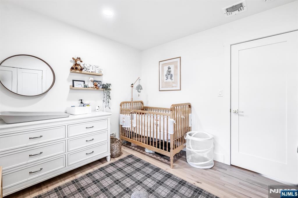408 Chelsea Street Paramus, NJ 07652 - Photo 29 of 49 a spacious bathroom with a double vanity sink a toilet and a window