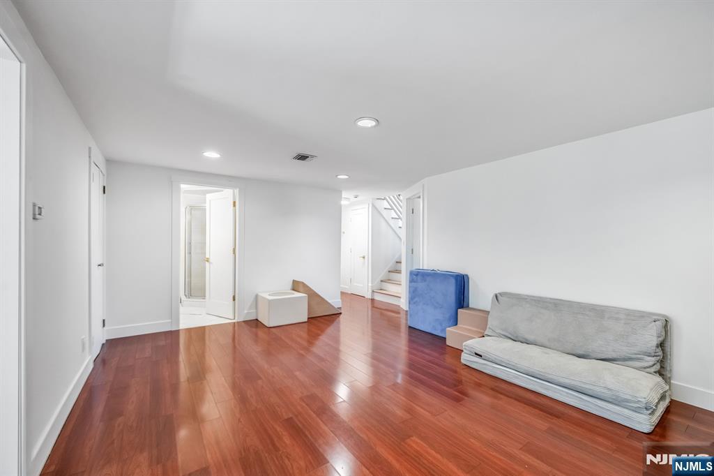 408 Chelsea Street Paramus, NJ 07652 - Photo 35 of 49 a living room with furniture and a wooden floor