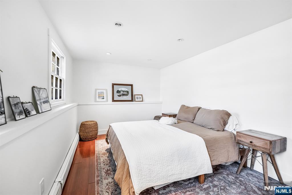 408 Chelsea Street Paramus, NJ 07652 - Photo 37 of 49 a bedroom with a bed and a table