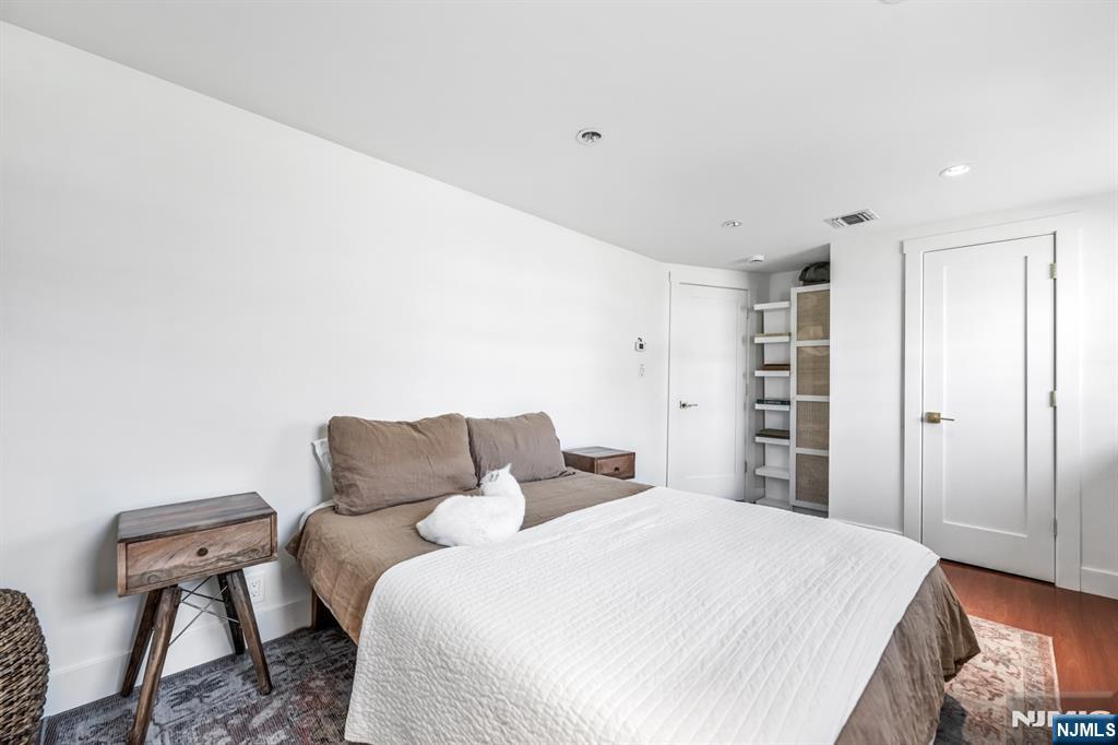 408 Chelsea Street Paramus, NJ 07652 - Photo 38 of 49 a bedroom with a bed and a chair