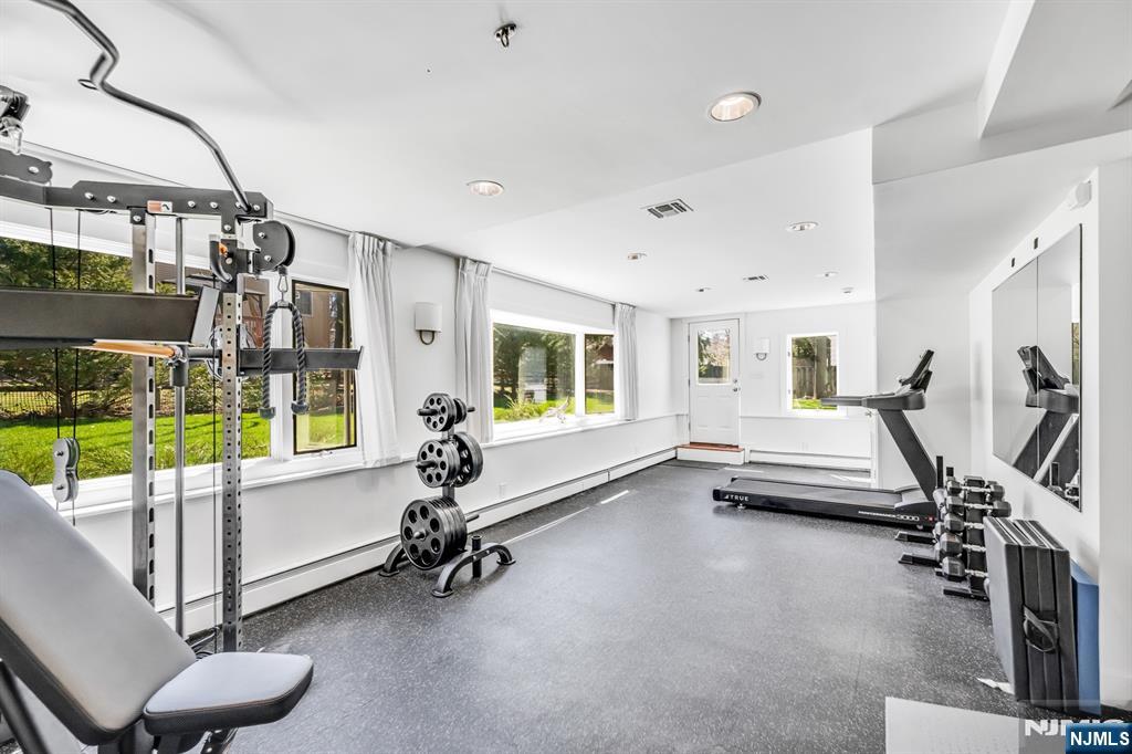 408 Chelsea Street Paramus, NJ 07652 - Photo 40 of 49 a view of a room with gym equipment
