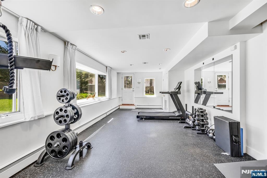 408 Chelsea Street Paramus, NJ 07652 - Photo 41 of 49 a view of a room with gym equipment