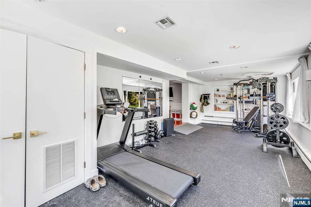 408 Chelsea Street Paramus, NJ 07652 - Photo 42 of 49 a view of a room with gym equipment