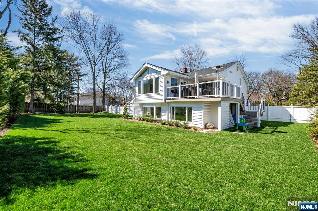 408 Chelsea Street Paramus, NJ 07652 - Photo 46 of 49 a front view of a house with a yard