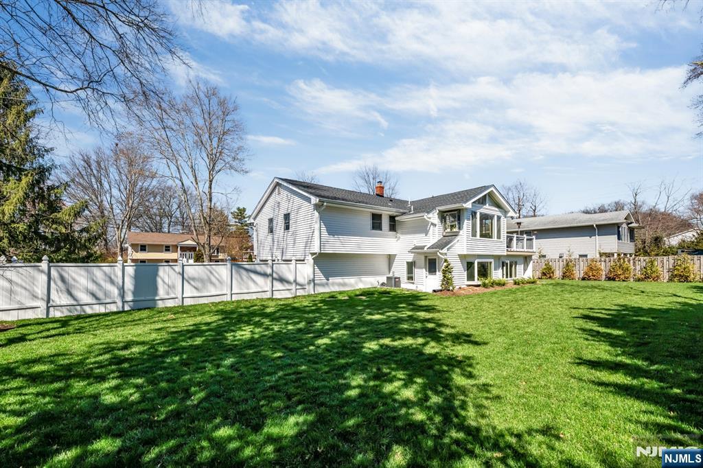 408 Chelsea Street Paramus, NJ 07652 - Photo 48 of 49 a house view with a sitting space and garden