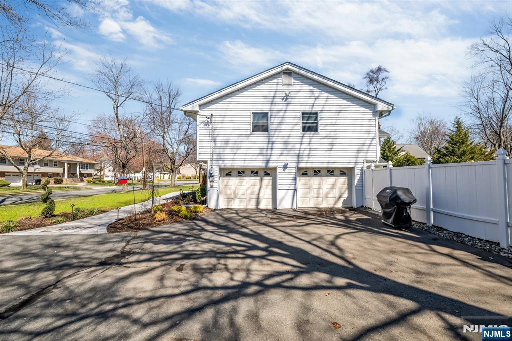 408 Chelsea Street Paramus, NJ 07652 - Photo 49 of 49 a view of a house with a swimming pool