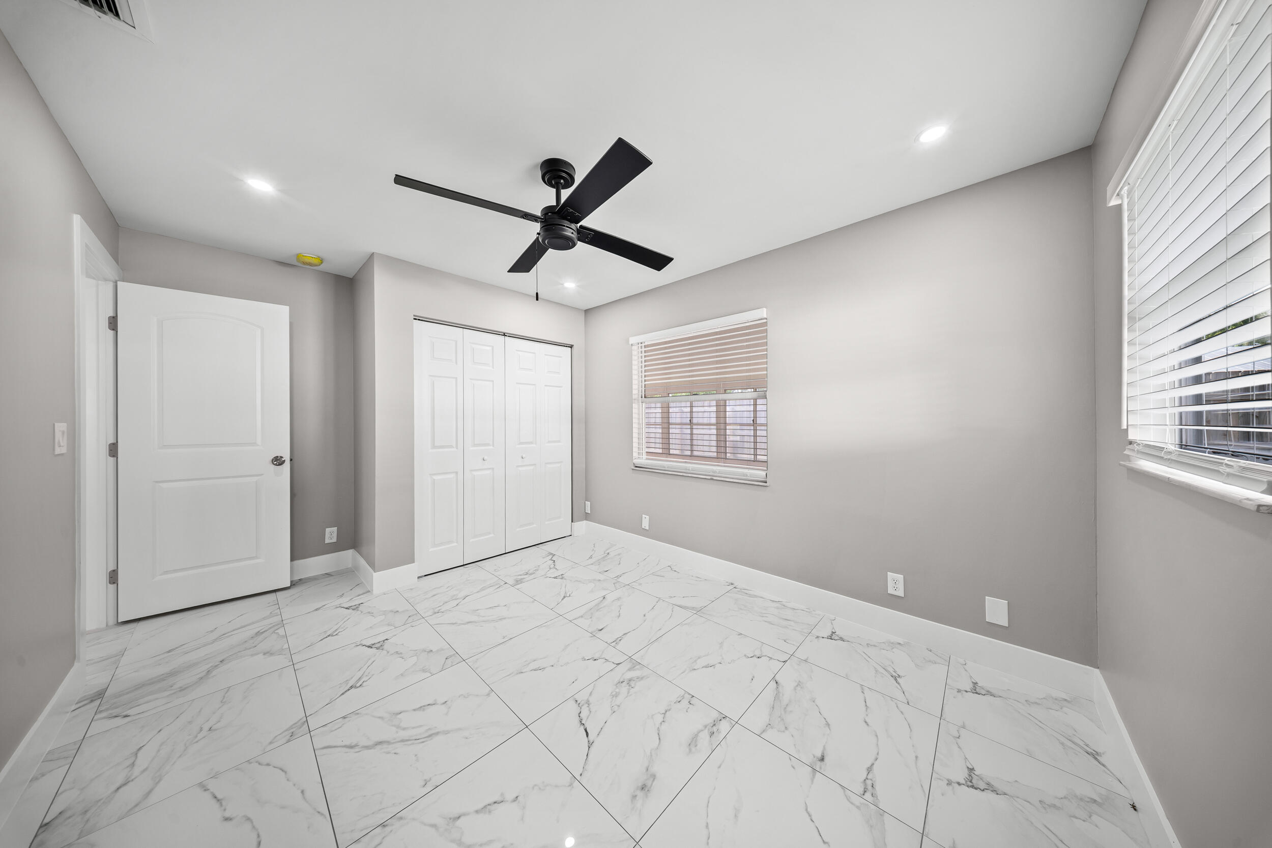 1627 Southeast Monroe Street Stuart, FL 34997 - Photo 21 of 33 a view of a livingroom with a ceiling fan and window