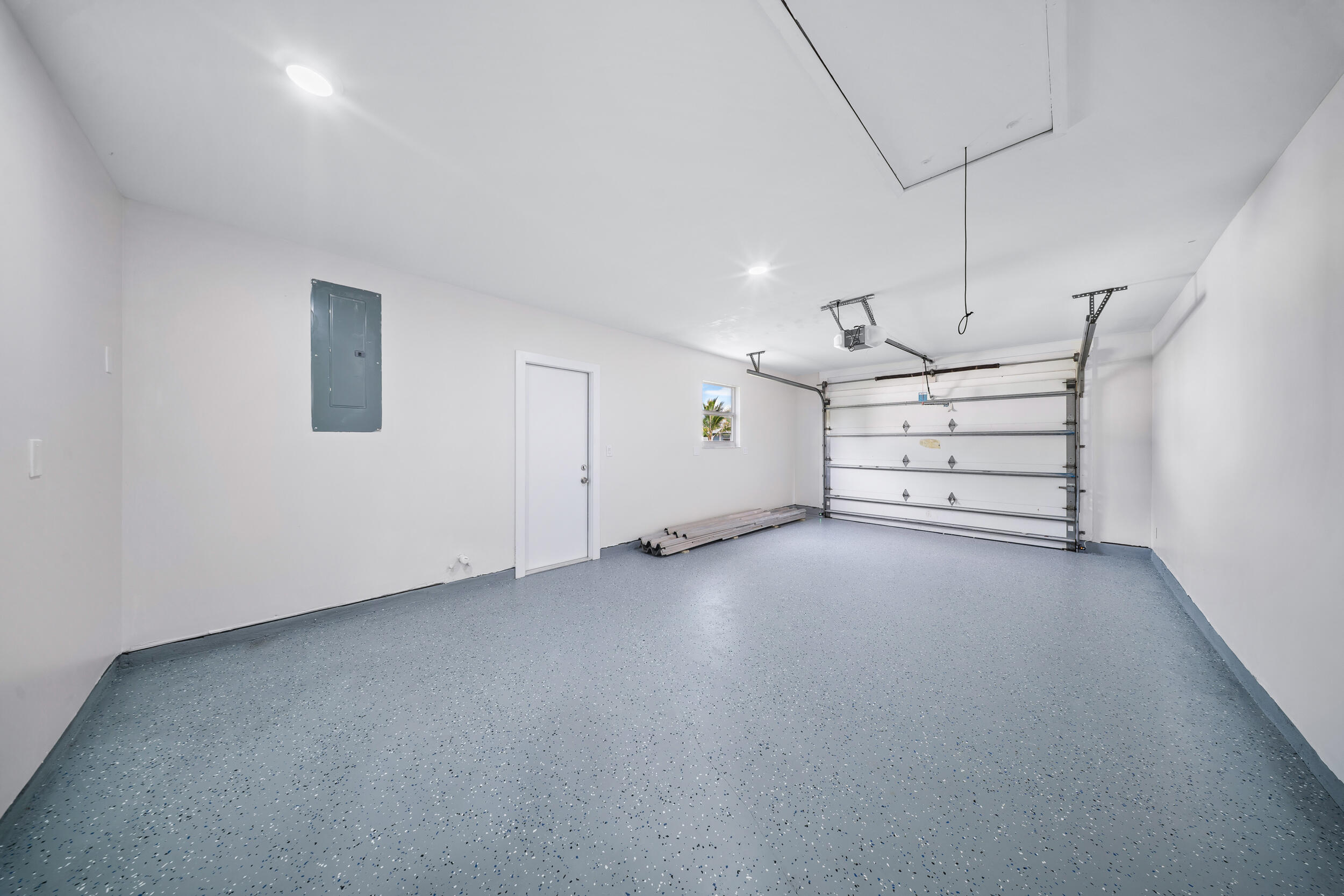 1627 Southeast Monroe Street Stuart, FL 34997 - Photo 23 of 33 an empty room with a ceiling fan and window