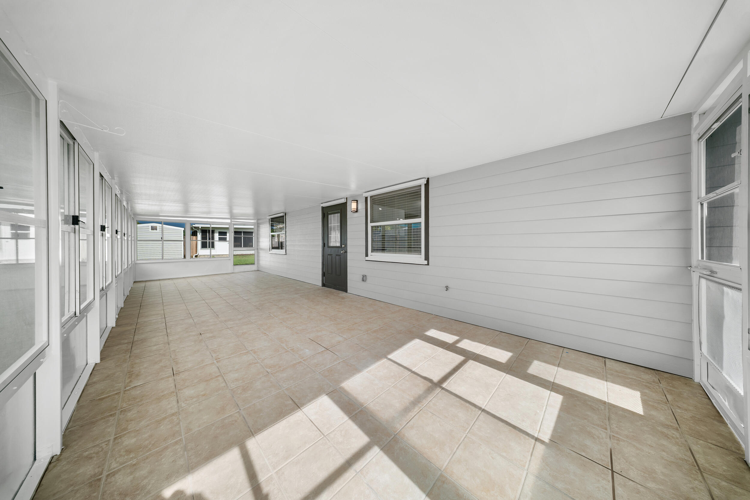 1627 Southeast Monroe Street Stuart, FL 34997 - Photo 24 of 33 a view of a big room with windows
