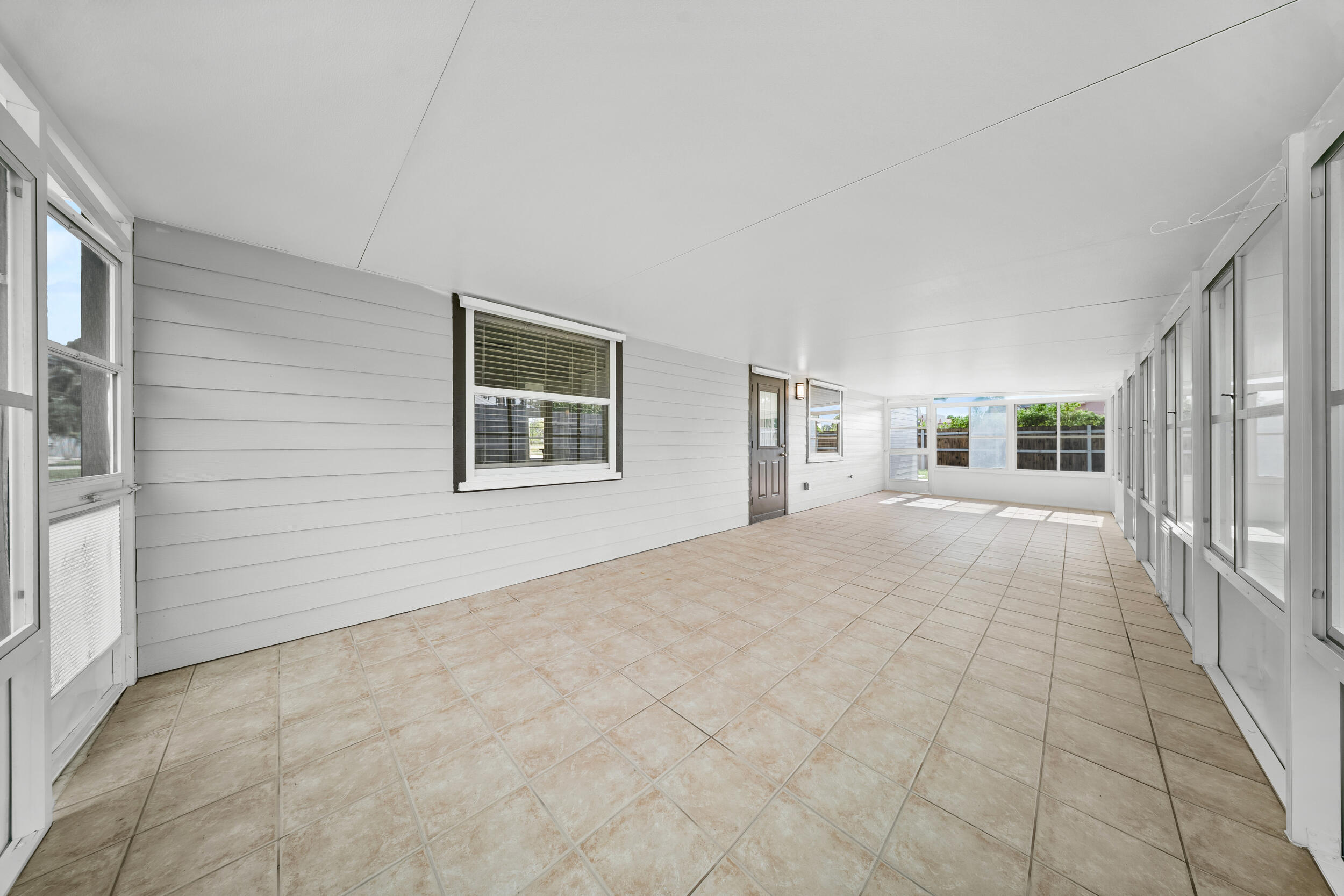 1627 Southeast Monroe Street Stuart, FL 34997 - Photo 25 of 33 a view of house with yard and hallway