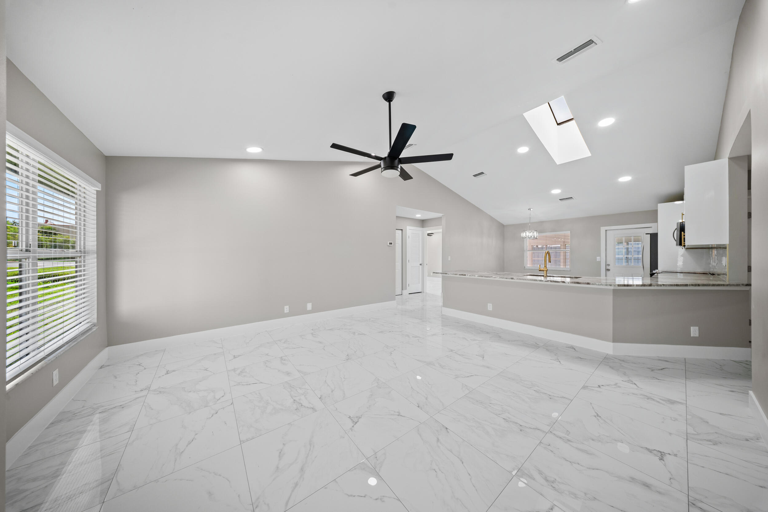 1627 Southeast Monroe Street Stuart, FL 34997 - Photo 5 of 33 a view of a livingroom with a kitchen