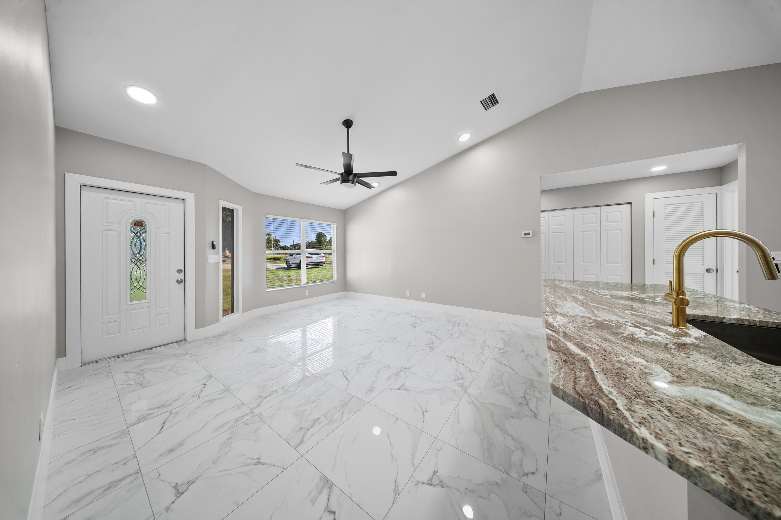 1627 Southeast Monroe Street Stuart, FL 34997 - Photo 7 of 33 a view of a kitchen with a sink and faucet