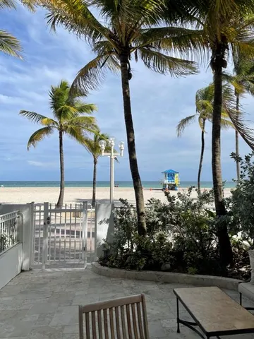 a view of balcony and yard