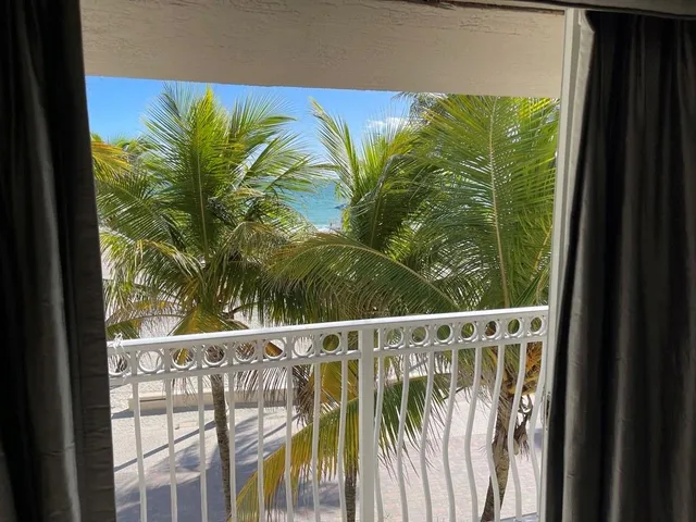 a spacious bathroom with a tub sink and mirror
