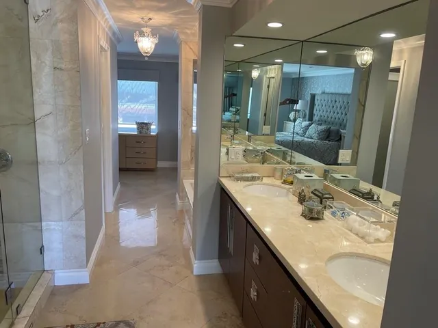 a bathroom with a sink double vanity and shower