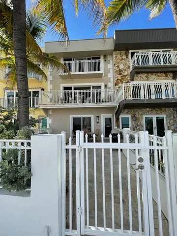 a front view of a building with glass windows and entryway