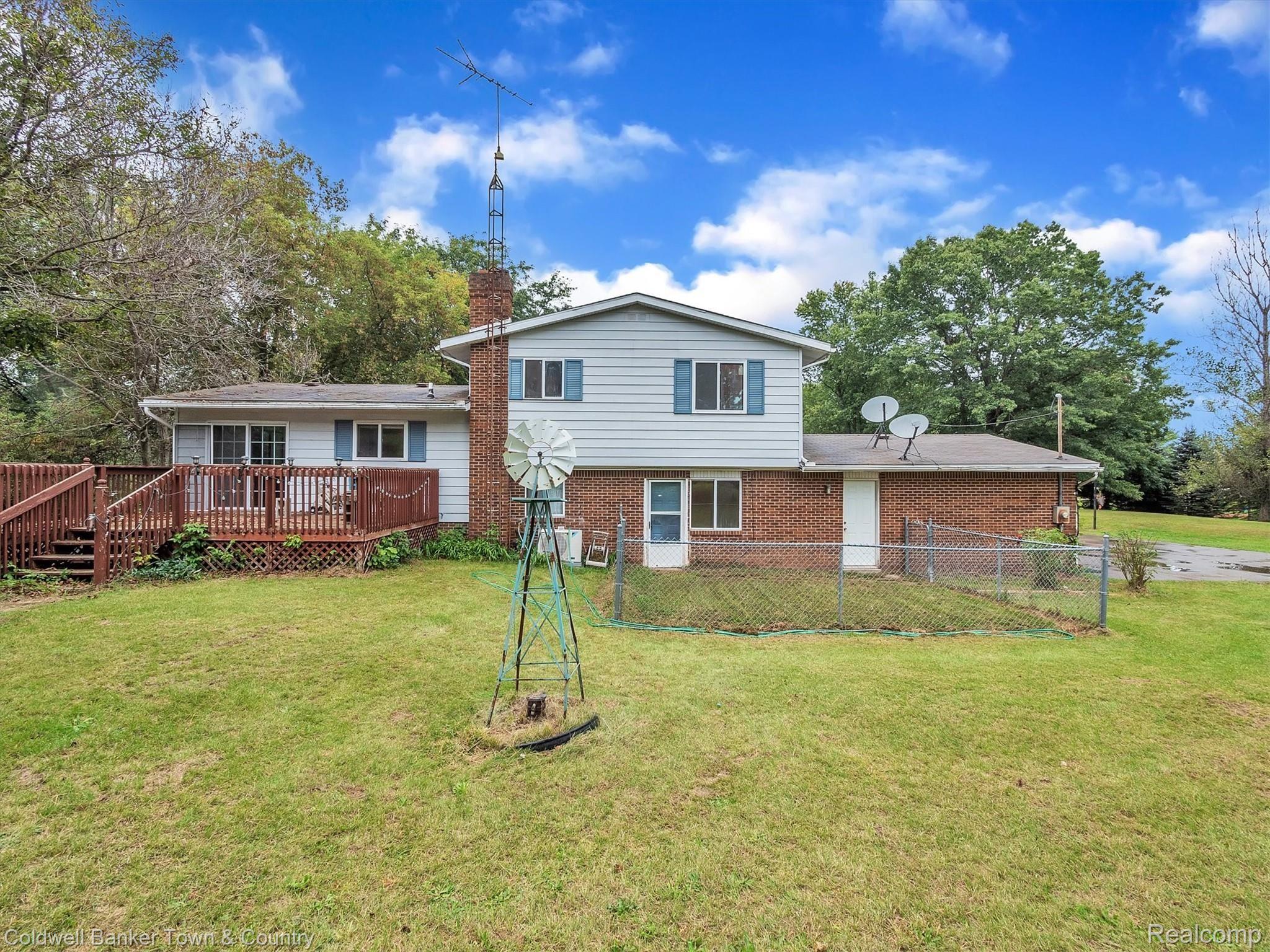 5432 Evans Road Holly, MI 48442 - Photo 35 of 39 Backyard with convenient fenced in area for pets/animals.