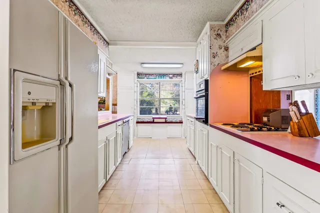 a living room with dining table and a table