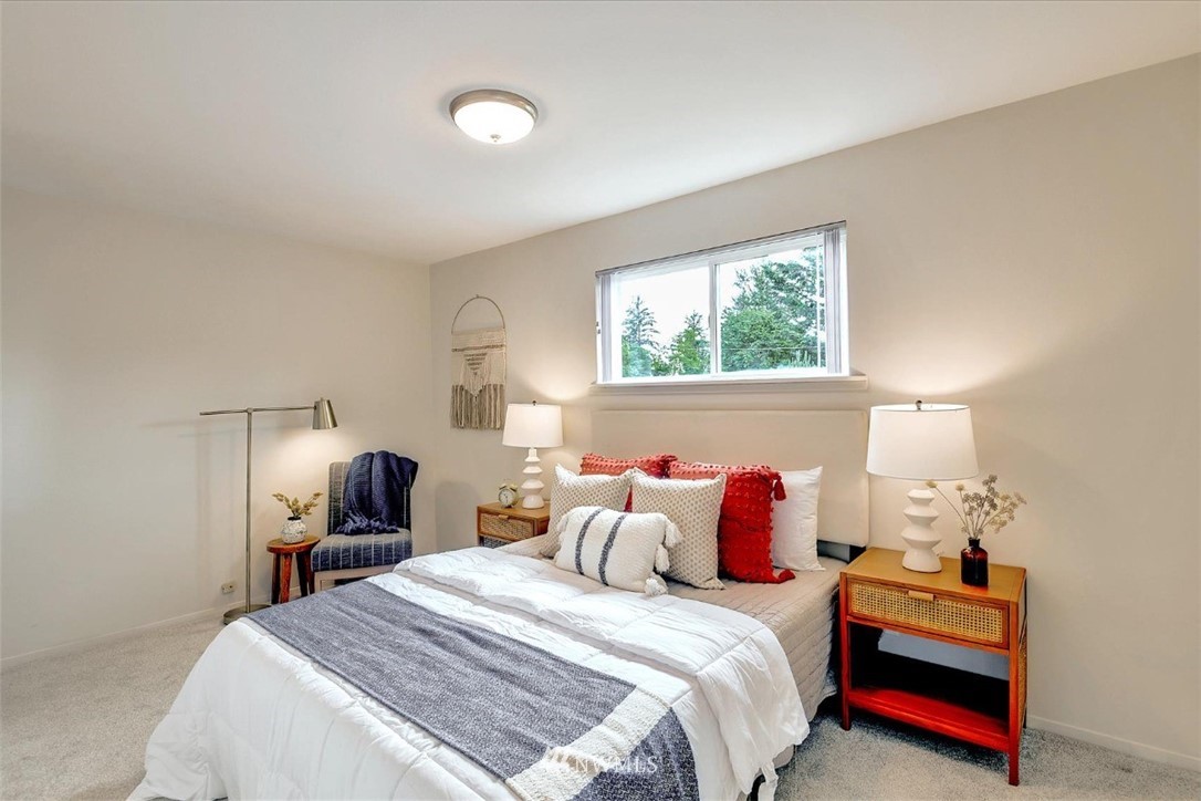 5202 Northeast 3rd Street Renton, WA 98059 - Photo 14 of 27 a bedroom with a bed and wooden floor