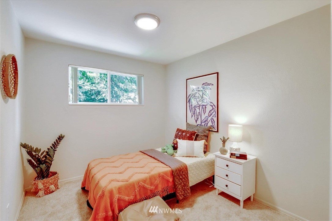 5202 Northeast 3rd Street Renton, WA 98059 - Photo 15 of 27 a bedroom with bed and a window