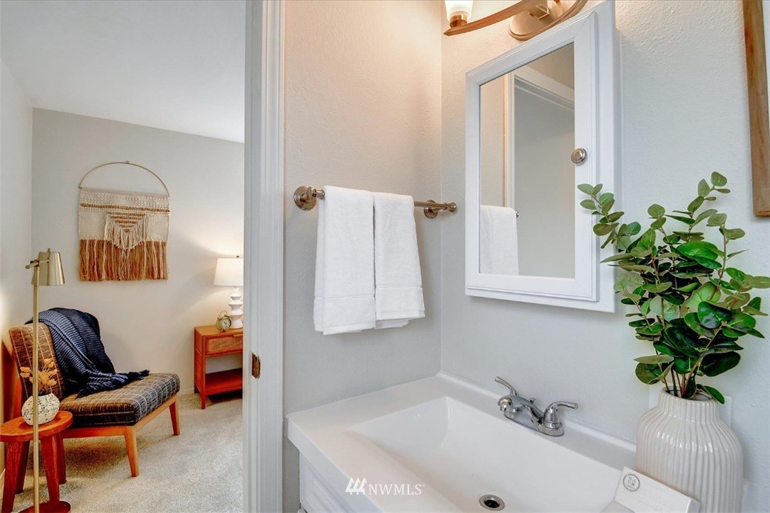 5202 Northeast 3rd Street Renton, WA 98059 - Photo 18 of 27 a bathroom with a sink and a mirror