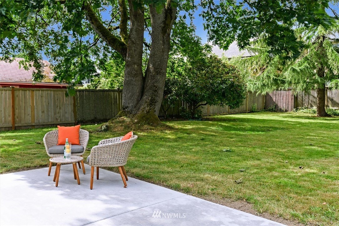 5202 Northeast 3rd Street Renton, WA 98059 - Photo 23 of 27 a backyard of a house with table and chairs