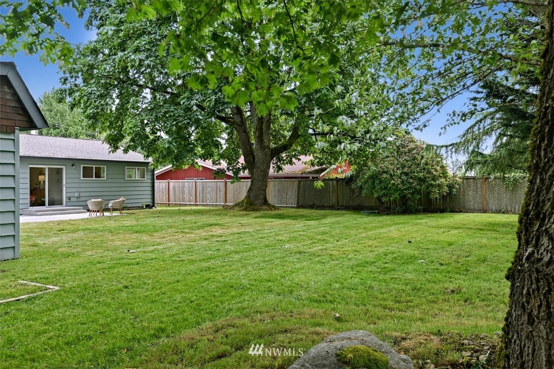 5202 Northeast 3rd Street Renton, WA 98059 - Photo 25 of 27 a backyard of a house with lots of green space