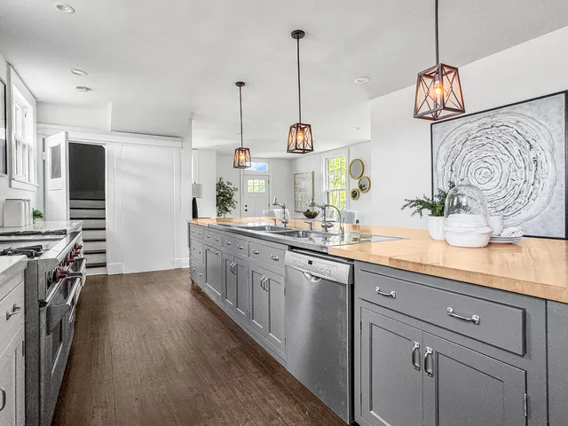 a dining room with furniture and wooden floor