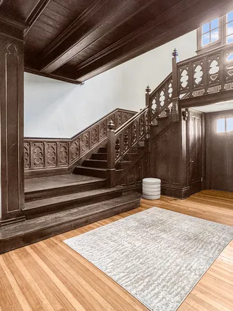 a view of a entryway door with wooden floor