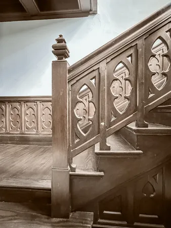 a bedroom with a bed a couch and large window