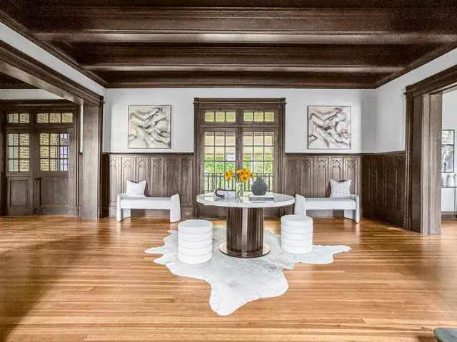 a living room with furniture and a table