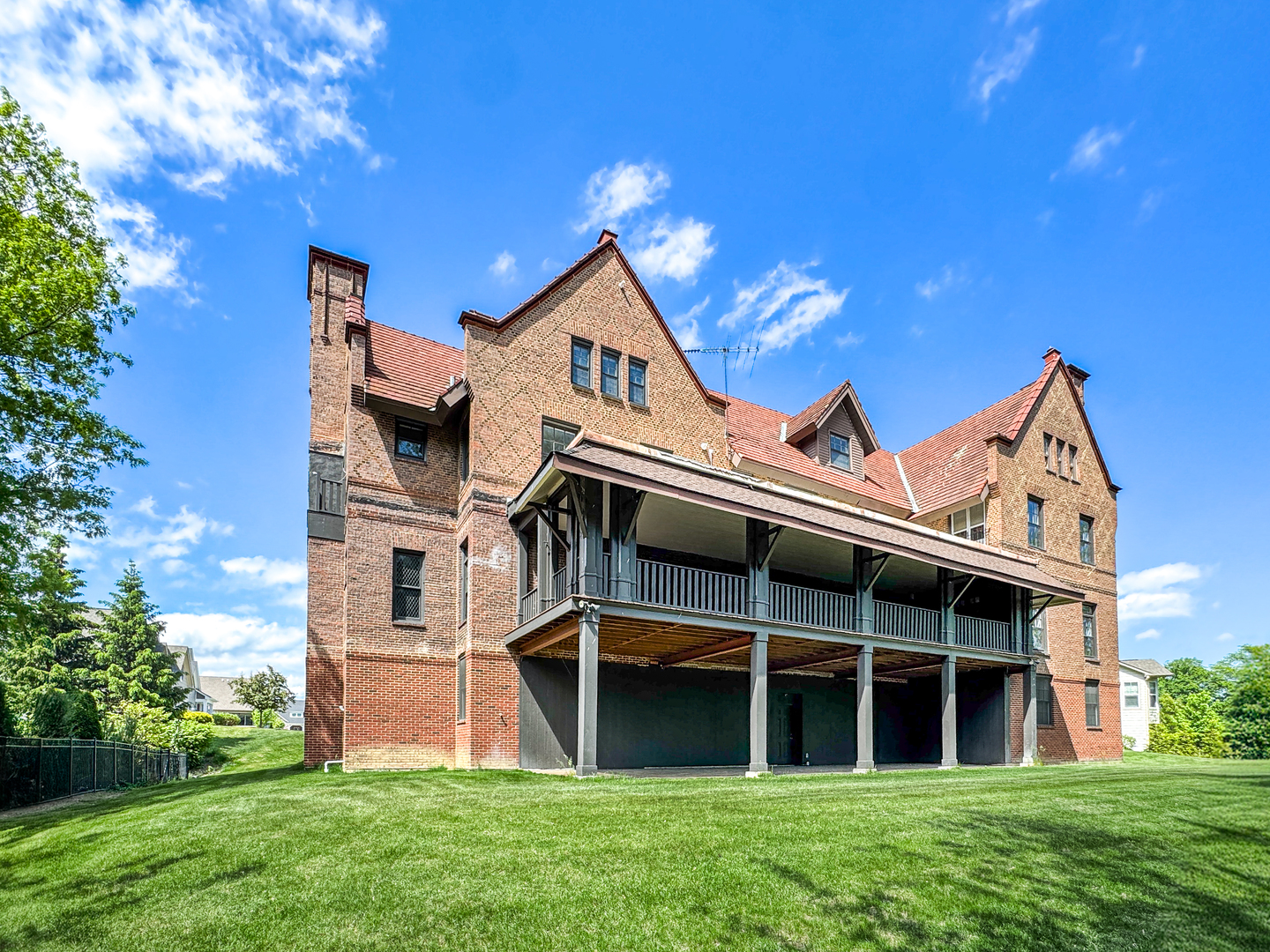 141 Loretto Court Wheaton, IL 60189 - Photo 37 of 46 a view of a house with a large window and a yard with plants and large tree