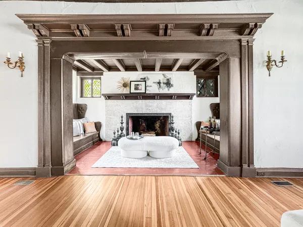 a view of a livingroom with a fireplace and cabinet