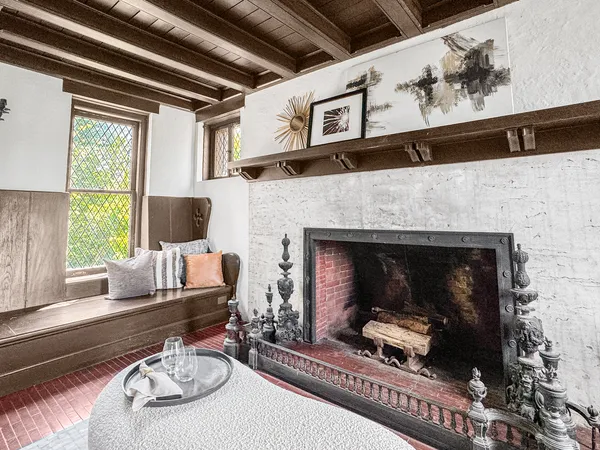 a living room with furniture and a fireplace