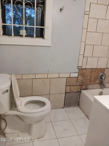 a bathroom with a toilet and a sink