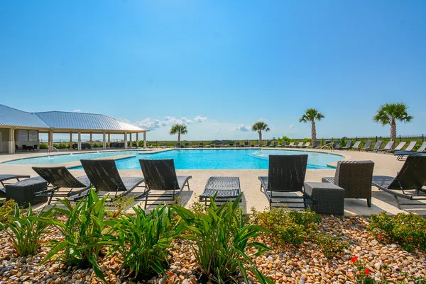 a roof deck with table and chairs