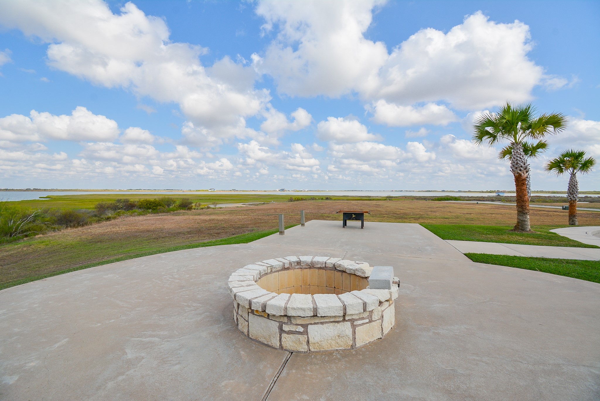 3036 Sandy Lane Palacios, TX 77465 - Photo 11 of 32 a view of a swimming pool with a garden