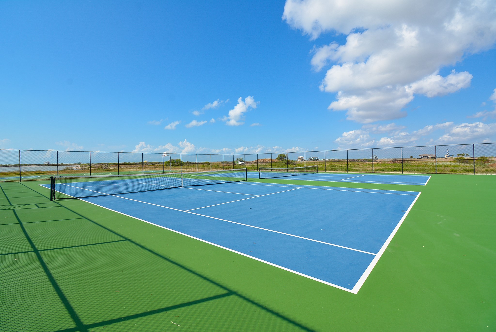 3036 Sandy Lane Palacios, TX 77465 - Photo 14 of 32 a view of an outdoor space and tennis court